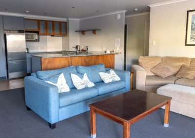 The Reef | 2 Bedroom Poolside Apartment | Lounge & Kitchen