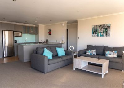 The Reef | 2 Bedroom Poolview Apartment | Lounge & Kitchen